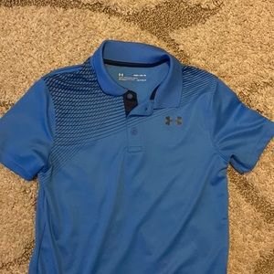 Sky blue polo with black design on shoulders. Loose fit, heatgear